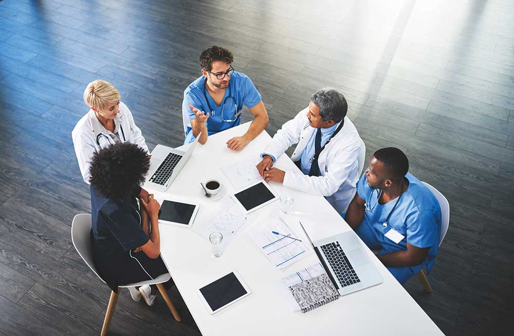 medical staff around desk